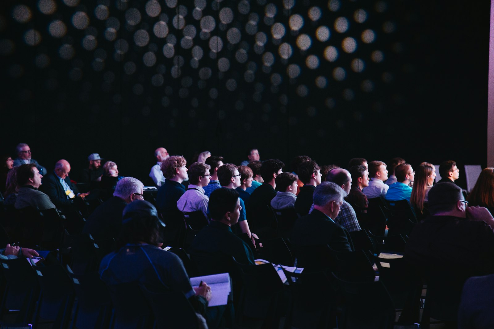 Delegates listening to a presentation at a conference