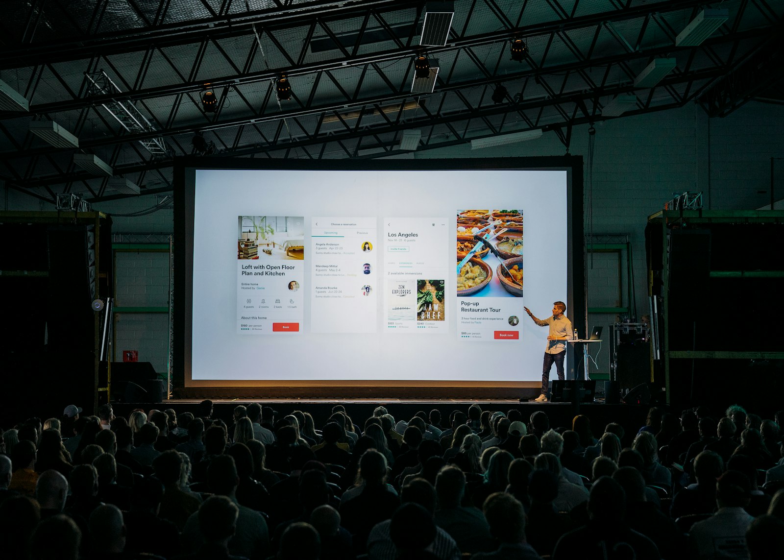 Presenter addressing an audience at a design conference