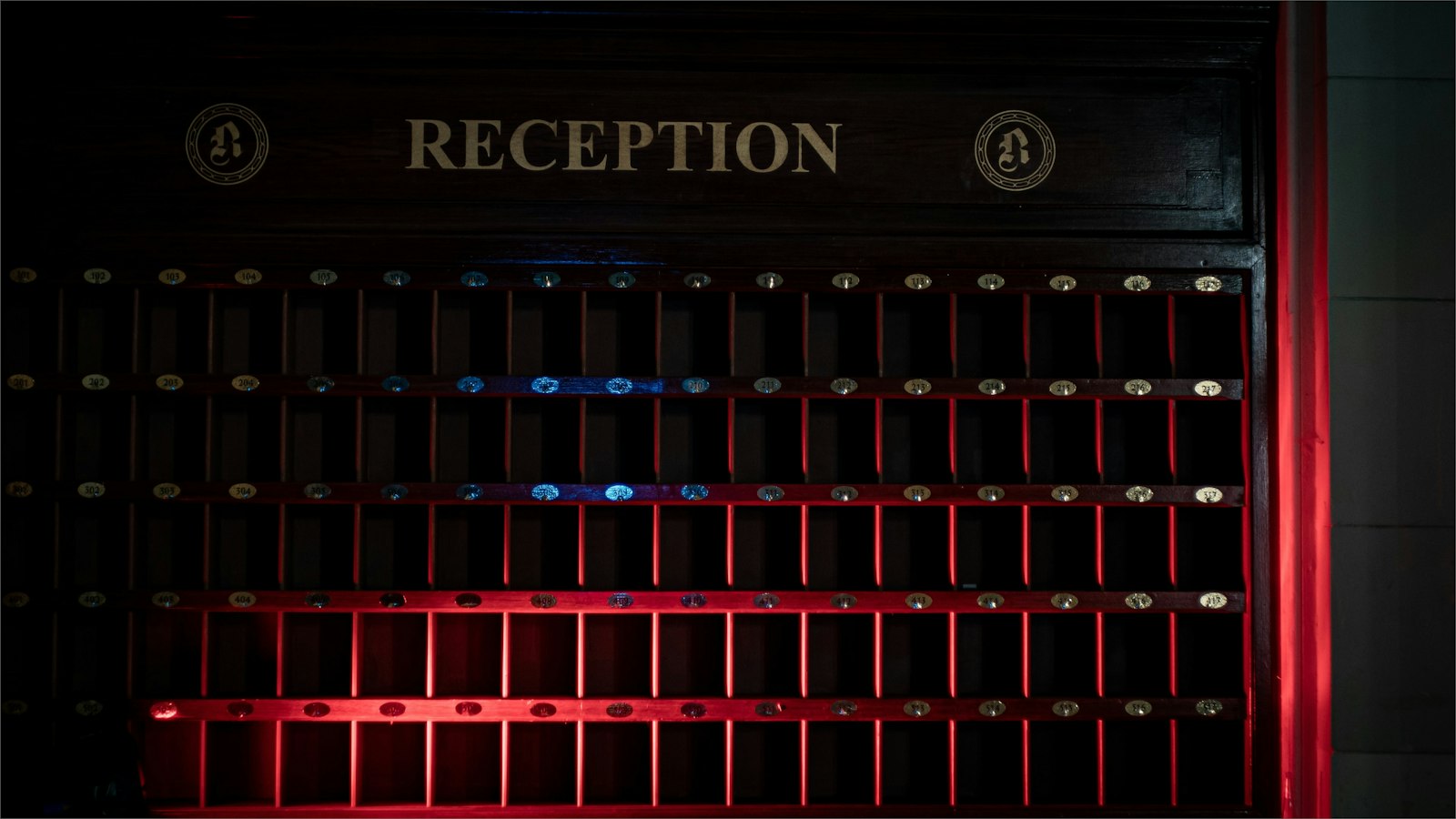 Traditional hotel reception desk and key compartments