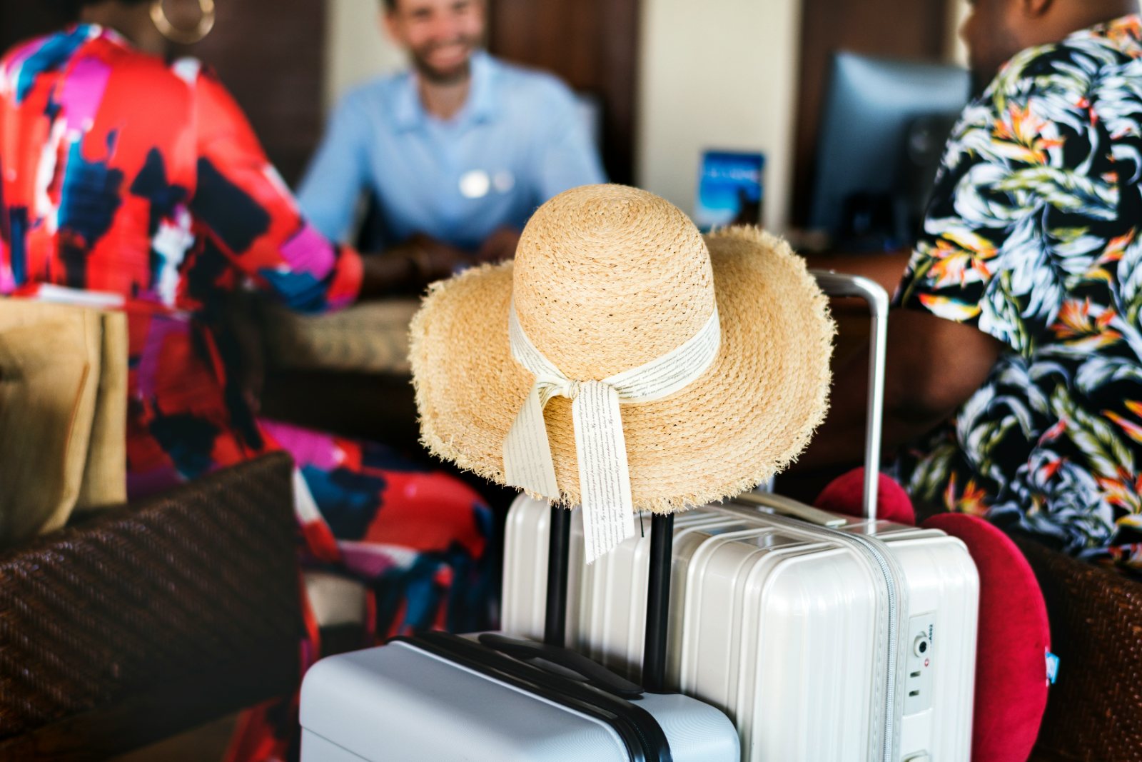 Guests checking in at a hotel reception desk